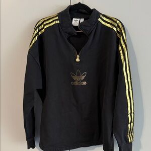 Adidas Black pullover with Gold Zipper and detail.